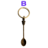 Cuchara para esnifar color cobre con llavero incorporado.