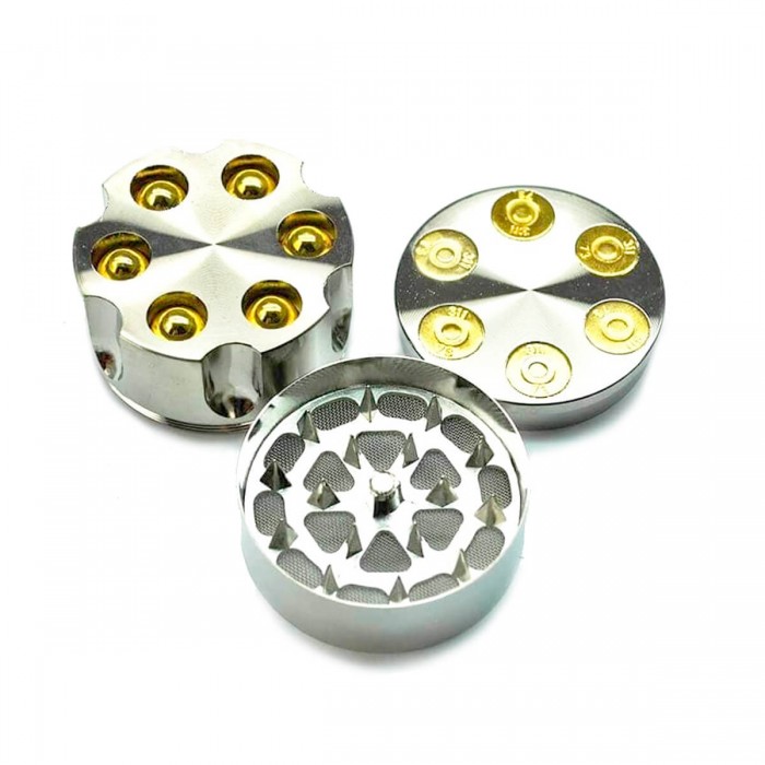 Grinder para marihuana con forma de revólver y polinizador.
