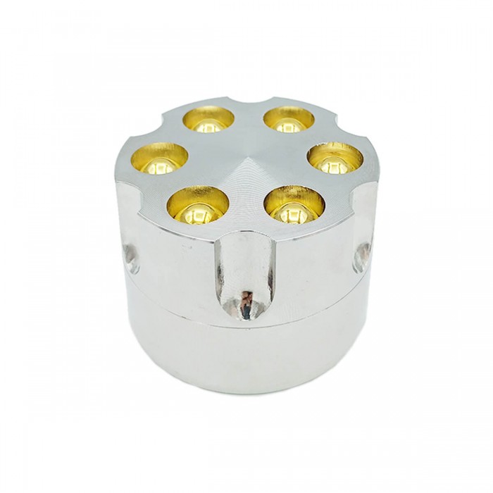 Grinder para marihuana con forma de revólver y polinizador, cerrado.