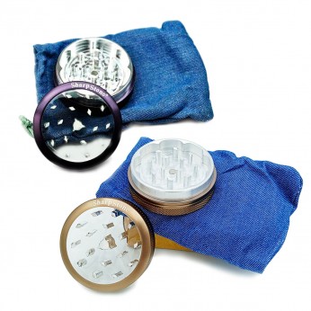 Grinder para marihuana hecho de metal y con tapa transparente y funda, diferentes colores.